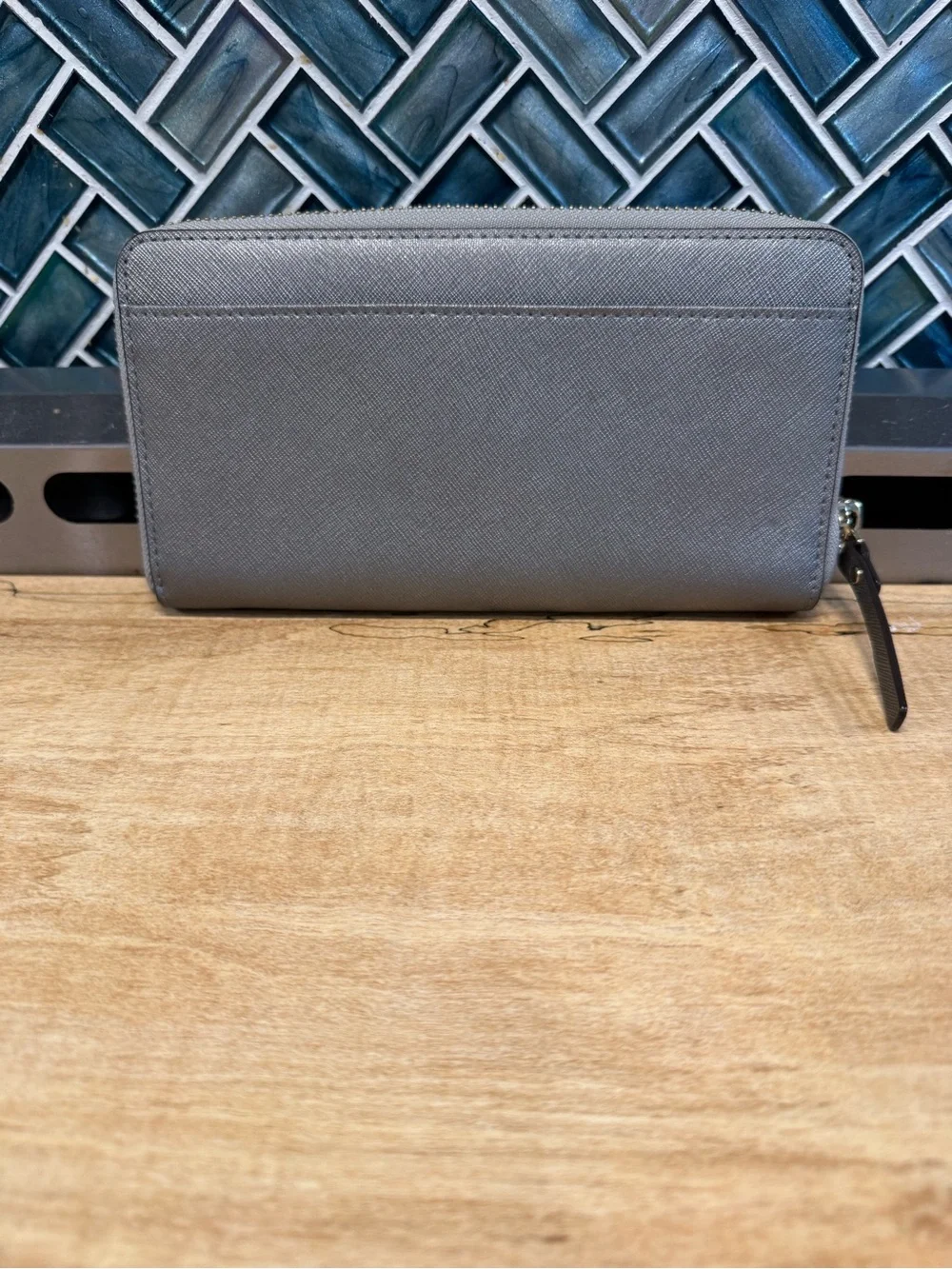 kate spade metallic gray zip-around wallet with gold logo